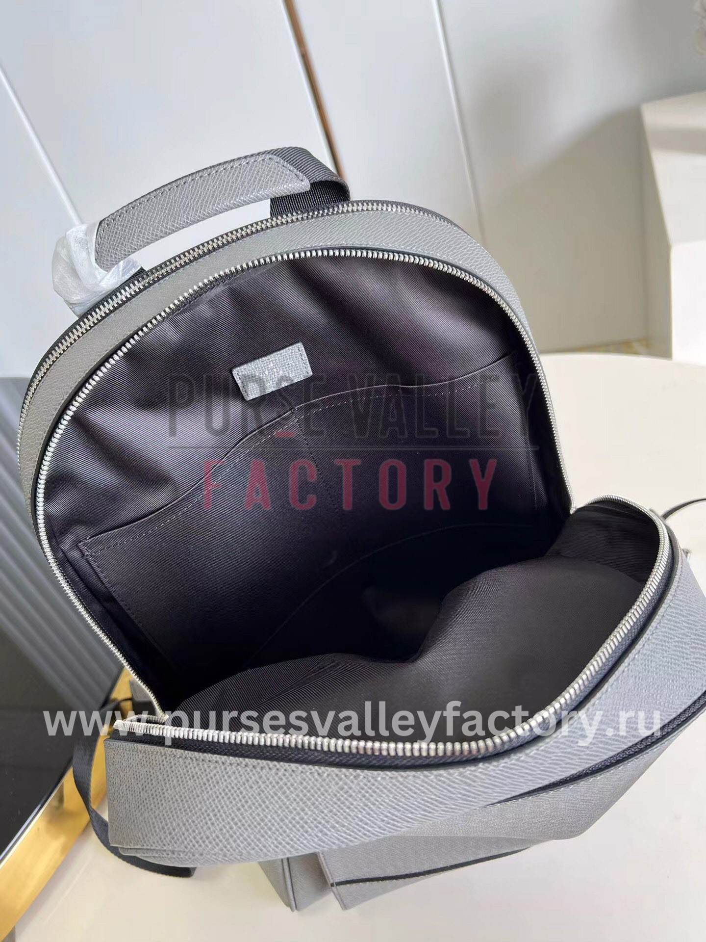 LOUIS VUITTON ADRIAN BACKPACK TAIGA LEATHER
